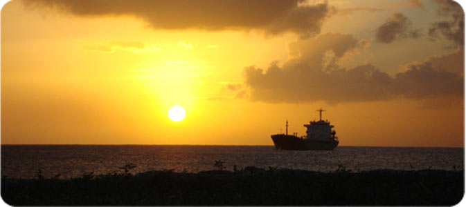 Ship at Sunset Near the Barbados Port